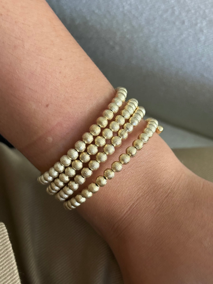 GOLD HAMMERED BALL BANGLE
