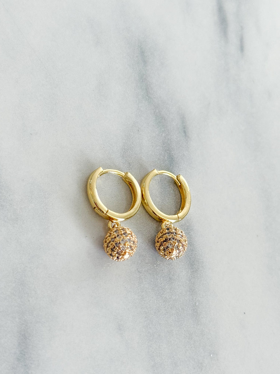 CLEAR PAVÉ BALL HUGGIE EARRINGS