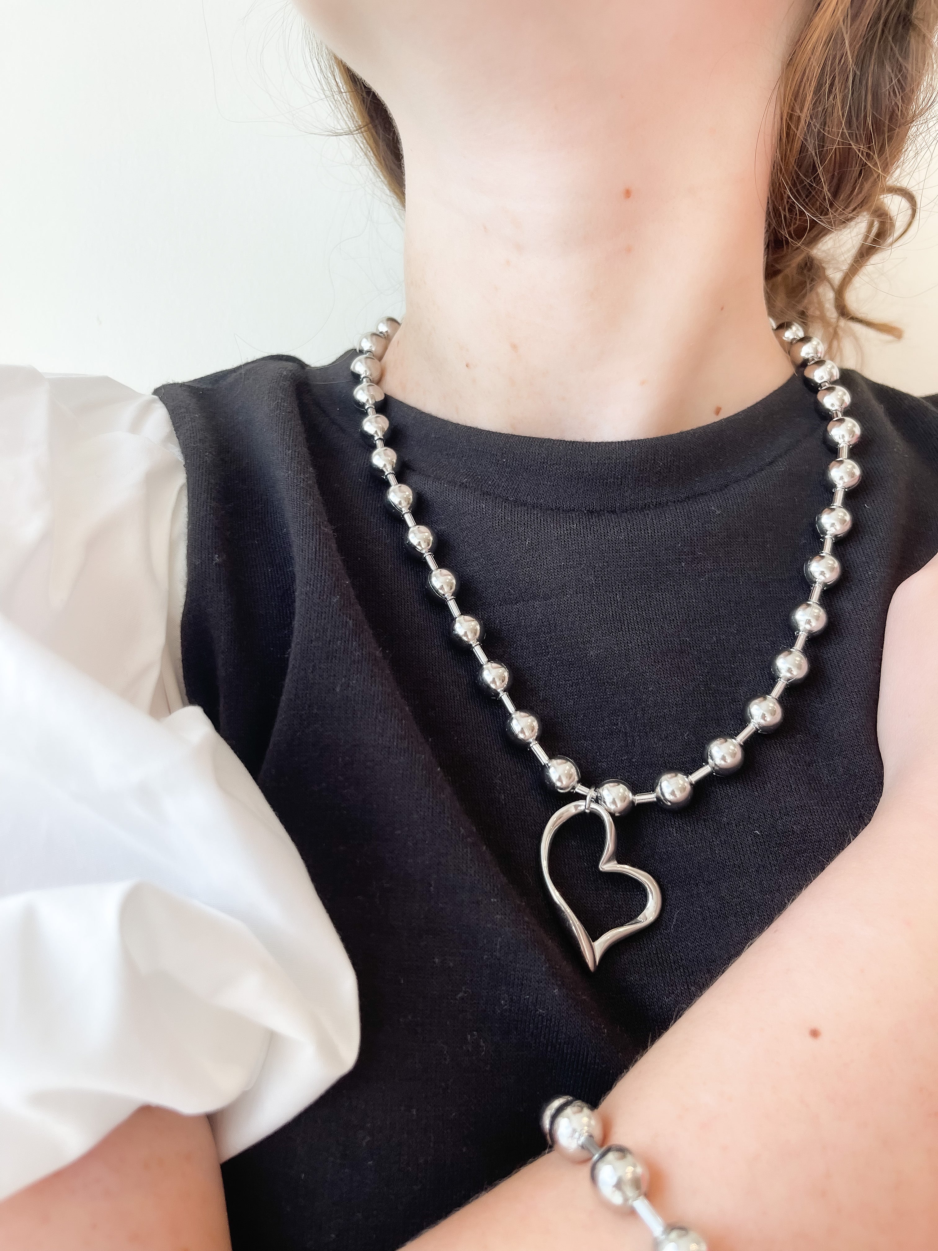 SILVER TWISTED HEART NECKLACE